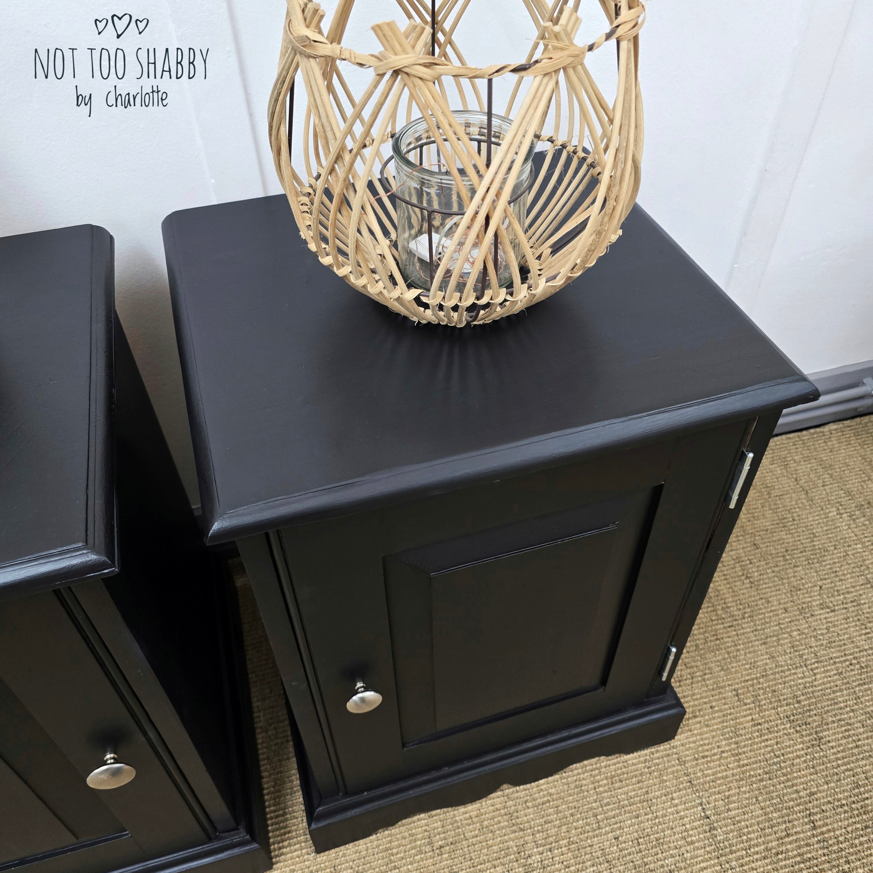 Top of pair of Coal Black painted pine cupboards with silver knobs and hinges