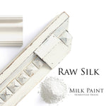 Load image into Gallery viewer, Homestead House Milk Paint Raw Silk Flat Lay with powder, painted trim and chippy moulding
