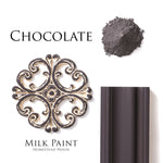 Load image into Gallery viewer, Homestead House Milk Paint Chocolate Flat Lay with powder, painted trim and distressed moulding with white liming wax
