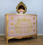 Load image into Gallery viewer, Petit a Petit Redesign with Prima Transfer from the Kacha Collection featuring gold scrolls and pretty pink roses and flowers on a pale pink and gold sideboard
