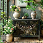Load image into Gallery viewer, A chest of drawers with the Butterfly Conservatory Tales Redesign with Prima Decoupage Fibre Paper showcasing a large and detailed moth in earthy colours on the front staged surrounded by plants
