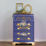 Load image into Gallery viewer, Les Roses Redesign with Prima Extra Large Transfer from the Kacha Collection, delicate pink roses and gold french script on the front of a blue chest of drawers
