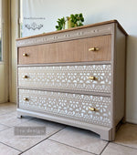 Load image into Gallery viewer, Classic Lace Redesign with Prima Stick and Style Peel and Stick Reusable Self Adhesive Stencil Roll used to stencil lace stripes on a taupe chest of drawers
