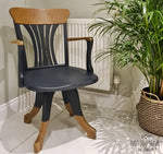 Load image into Gallery viewer, Midnight Blue Fusion Mineral Paint captains chair with taped oak feature feet and arms
