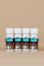 Load image into Gallery viewer, Four bottles of 50g Polyvine oil colorant on a beige background
