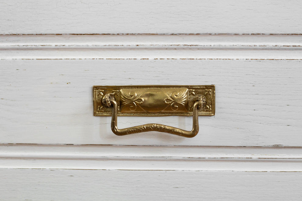 Homestead House Milk Paint Sturbridge White distressed drawer with vintage brass handled close up