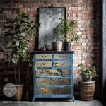 Load image into Gallery viewer, Rustic Refuge Redesign with Prima Decoupage Fiber Paper featuring a bird on a vintage aged blue chest of drawers against a brick wall
