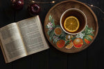 Load image into Gallery viewer, Citrus Slice Redesign with Prima Small Transfer - whole and sliced oranges amongst dark green leaves and delicate white orange blossom usedto decorate an wooden plate
