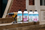 Load image into Gallery viewer, Range of Polyvine exterior extreme varnish bottles with a drill on a wooden surface.
