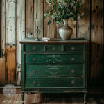 Load image into Gallery viewer, Satin Soie Redesign with Prima Stencil from the Kacha Collection featuring vintage french typography in white on a distresses emerald green chest of drawers
