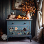 Load image into Gallery viewer, Willow Way Redesign with Prima Middy Transfer - Autumnal flowers, foliage and antlers on a grey blue chest of drawers in a dark moody room
