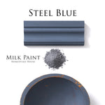 Load image into Gallery viewer, Homestead House Milk Paint Steel Blue Flat Lay with powder, painted trim and chippy bowl
