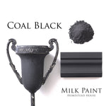 Load image into Gallery viewer, Homestead House Milk Paint Coal Black Flat Lay with powder, painted trim and distressed metal vase
