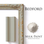 Load image into Gallery viewer, Homestead House Milk Paint Bedford Flat Lay with powder, painted trim and distressed photo frame
