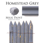 Load image into Gallery viewer, Homestead House Milk Paint Homestead Grey Flat Lay with powder, painted trim and distressed picket fence
