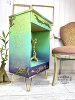 Load image into Gallery viewer, Eastern Abstract Redesign with Prima Stencil, intricate morrocan tile pattern raused gold stencil over a bright boho green and purple cupboard
