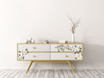 Load image into Gallery viewer, Redesign with Prima White Magnolia Tranfer on the front of a moder white and oak sideboard with a honeycomb design
