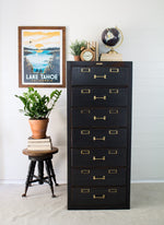 Load image into Gallery viewer, Homestead House Coal Black vintage painted wooden filing cabinet with gold hardwear
