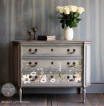 Load image into Gallery viewer, Pastel Artistry Redesign with Prima Maxi Transfer - soft hand painted flowers and foliage positioned along the bottom of a grey driftwood stained chest of drawers
