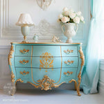 Load image into Gallery viewer, Chapelle Royale Redesign with Prima damask floral stencil in gold over a bright azure turquoise chest of drawers
