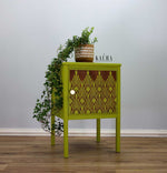 Load image into Gallery viewer, Sunlit Diamonds Redesign with Prima Stencil from the Kacha Collection - art deco fan design stencilled in a dark red onto a lime acidgreen little cabinet
