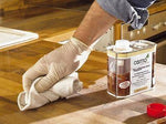 Load image into Gallery viewer, Osmo Top Oil, available in 7 colours, available in 3 sizes - being applied to a solid wood worktop
