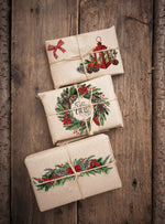 Load image into Gallery viewer, Classic Christmas Redesign with Prima transfer featuring poinsettias, fir, holly and ivy wreaths and garlands, bows, lanterns, stars and bells in traditional red and green on brown paper wrapped presents
