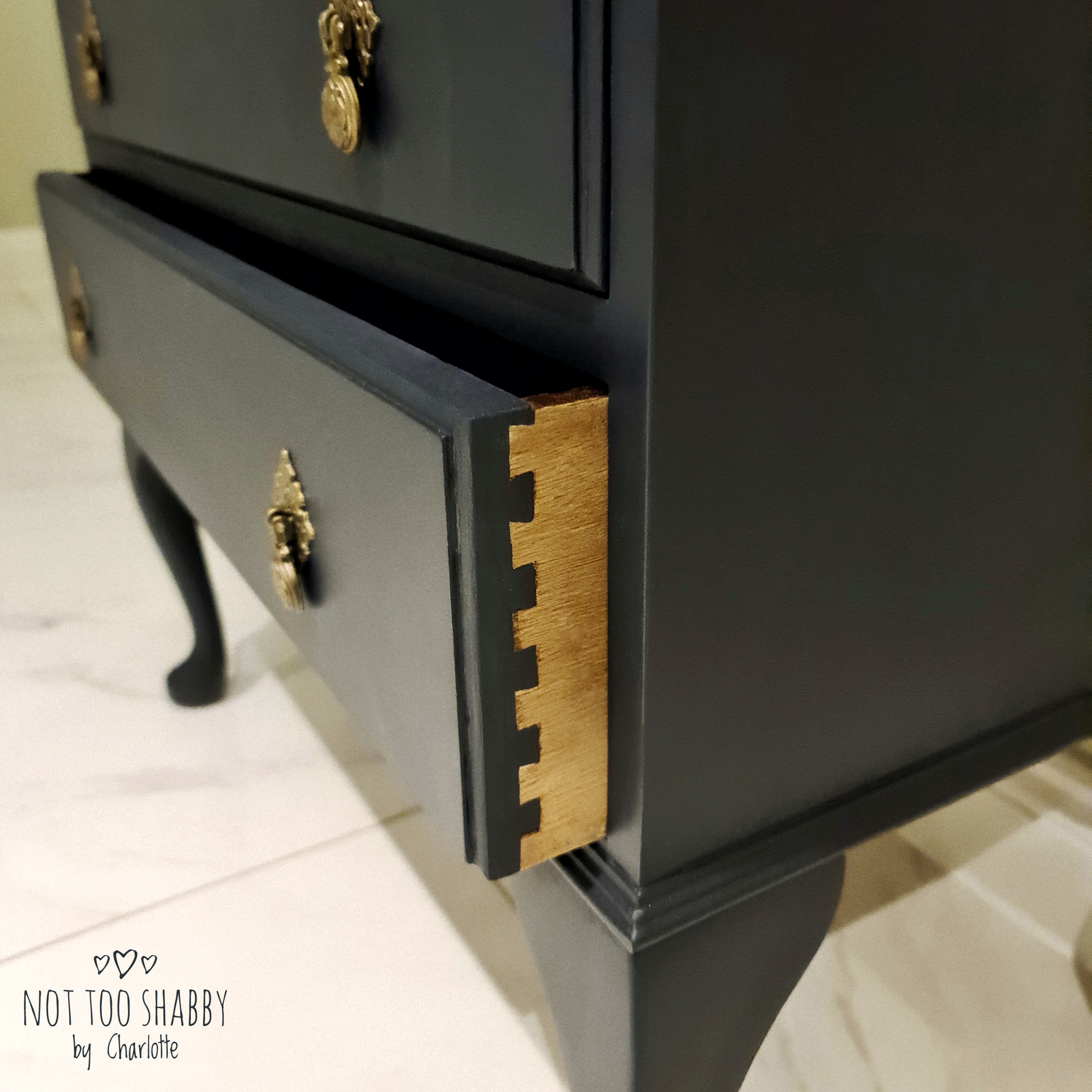 Taped dovetail joint detail on side of drawers 