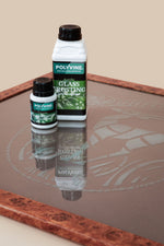 Load image into Gallery viewer, Two bottles of Polyvine acrylic glass frosting medium on a glass surface with a stencilled design
