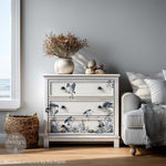 Load image into Gallery viewer, Whispers by the Marsh Redesign with Prima Middy Transfer with waterside blue flowers, pebbled and herons on the front of a white chest of drawers

