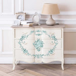 Load image into Gallery viewer, Minty Roses Redesign with Prima Maxi Transfer - mint coloured roses used to create a border design and central motif on a vintage white chest of drawers
