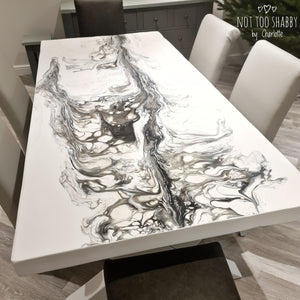 Black and white pouring resin dining table
